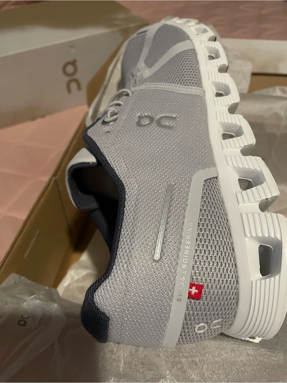 On Running Men’s Light Gray and Black Cloud-Inspired Sneakers
